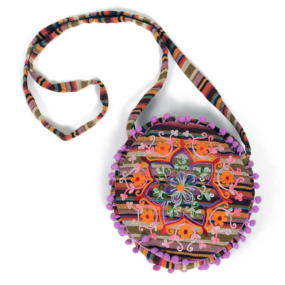 embroidered bag, round bag, floral pattern, pom pom trim, woven strap